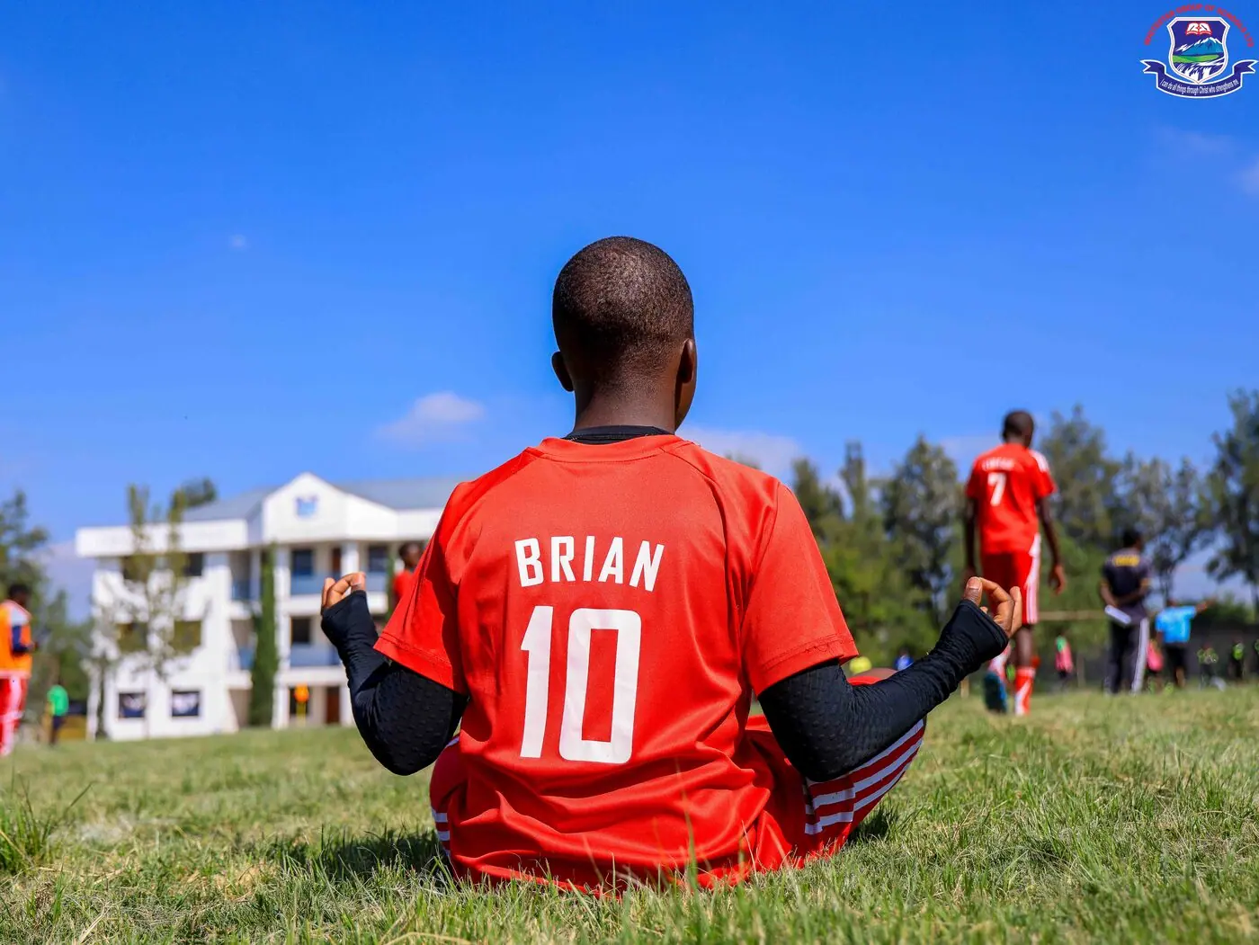 A Whitestar pupil watching a match from the touchline